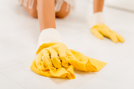 Close-up of a female hands scrubbing floor.の写真素材