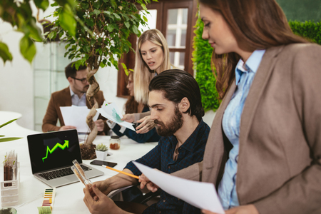 University biologists colleagues checking a quality of wheat and analysing of the sample of plant in the lab tube.の写真素材