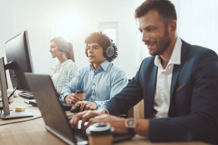 Startup team working on a new project in the casual office.の写真素材