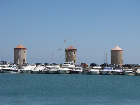 three old tower in Mandraki harbor photography oneのeditorial素材