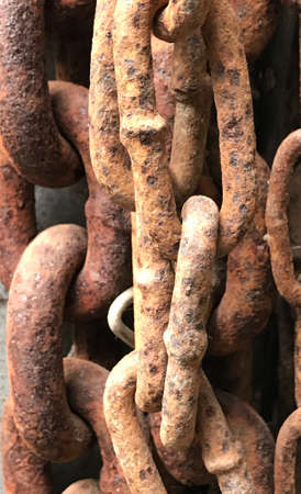 Rusty textured tangled chains rings background photo.