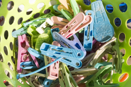 The colourfull of plastic clothespin in the plastic basketの写真素材