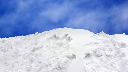 Selective focus little snow slope with blue sky