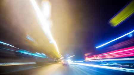 Blurred Abstract image of Long exposure night traffic light in the cityの写真素材