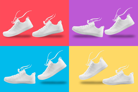 Pair of White sneaker four composition like walking and floating rope isolated on four color  background with clipping pathの写真素材