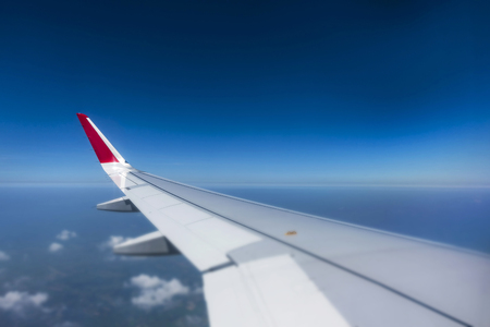 selective focus  Airplan wing above the blue skyの写真素材