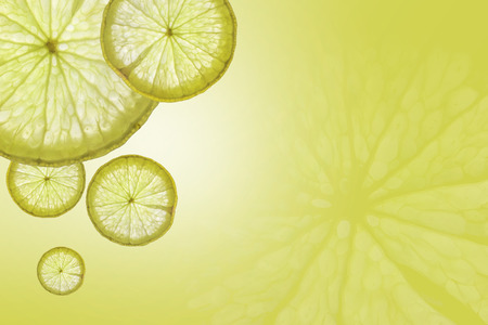 Flat lay Slice of lemon on green background , space for text