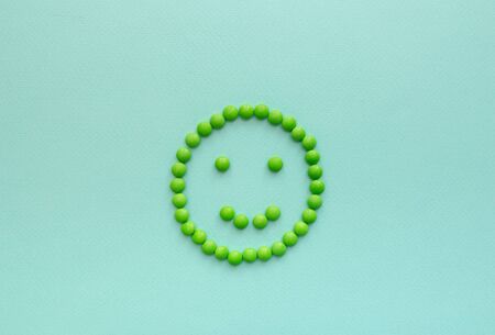 mug from pills on a blue background from the disease. center close-upの写真素材