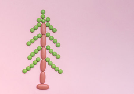 tree made of pills on a pink background. new Year. celebration. virusの写真素材