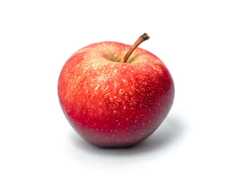 Fresh red apple isolated on white. Sweet delicious dessert. Side view. With water drops.