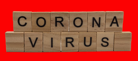 Letters on a red background. Corona virus. Information disease concept. Text on the background.の写真素材