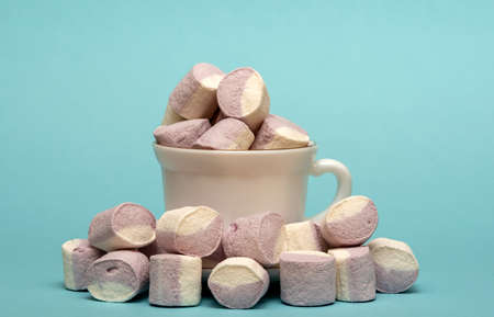 Fluffy white marshmallow macro isolated over white background. Heap of white marshmallows.の写真素材