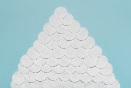 Cotton pads for removing makeup. On a blue background.の写真素材