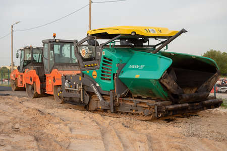 A construction machine is waiting for work in the summer. Excavator, tractor, earthworks....