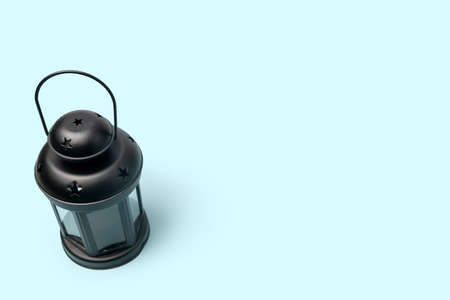 Black vintage lantern. Decorative. On a blue background. Arabic oriental.の写真素材