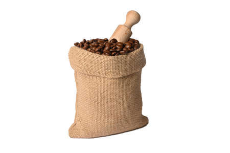 Black coffee in a burlap bag with a wooden scoop. On white background.の写真素材