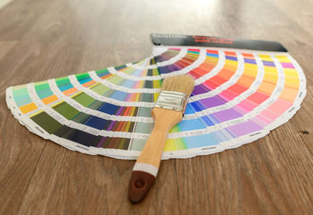 Volzhsky, Russia, 11.06.2021. On the floor are a designer's fan and a brush for painting the skirting board.の写真素材