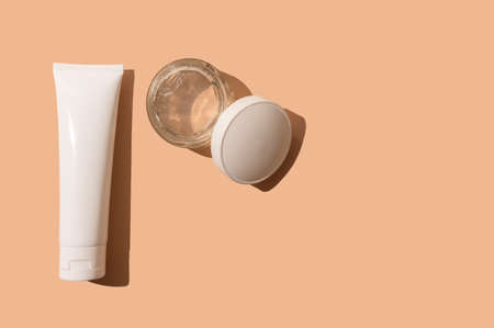 Natural cosmetic cream in a white package. Skin cream. On a beige background. Place for your text.の写真素材