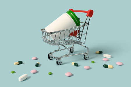 Pills in a mini basket. Buying and selling antibiotics. Treatment concept.の写真素材