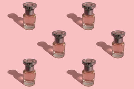 Perfume bottle for women. On a pink background. Cosmetics for women.の写真素材