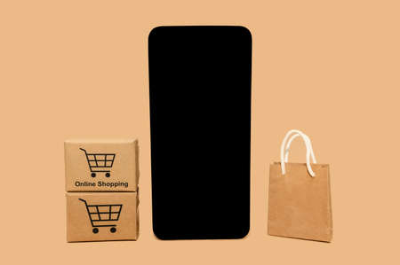 Minimalistic concept of buying and selling a phone. Modern layout for design. close-up. On a beige background.の写真素材