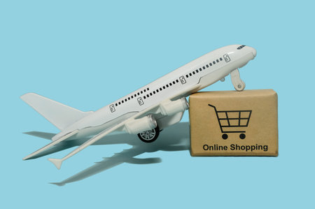 The concept of shopping and sales. Delivery by air. Airplane on a blue background.