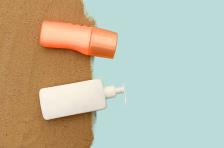 Orange and white container with cream and lotion. Sea concept.の写真素材