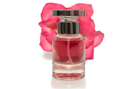 Pink rose and perfume bottle on a white background. Cosmetics for women.の写真素材