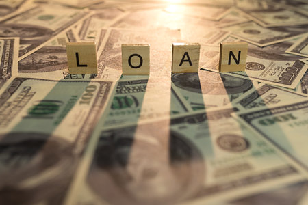 Wooden letters loan. On dollars. With black shadow. Letter closure. concept.