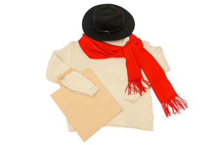 White jumper with red scarf and craft bag. black hat. On a white background.の写真素材