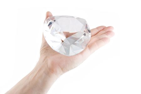 Crystal on an open male palmの写真素材