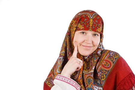 The Russian girl in a national scarf smiles