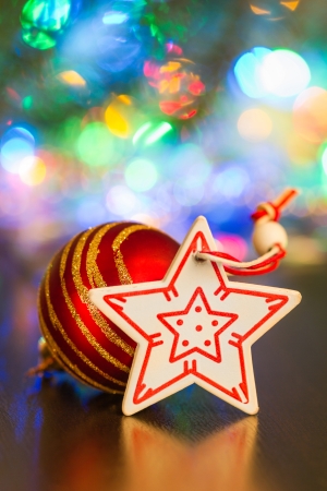 Christmas ball and star on a background of lights garlandの写真素材