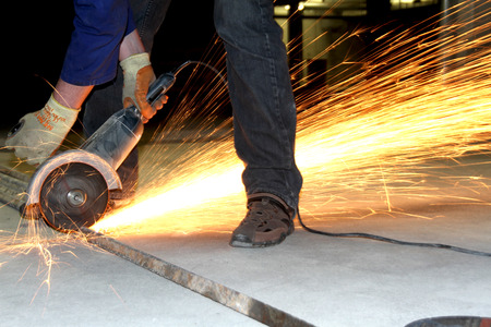 A man working with grinder.の写真素材