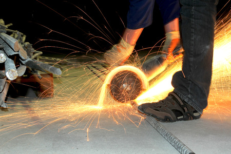 A man working with grinder.