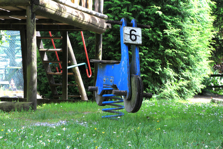 Spring bicycle on a childrens playgroundの写真素材