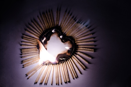 Heart from Matches is burning in Fireの写真素材