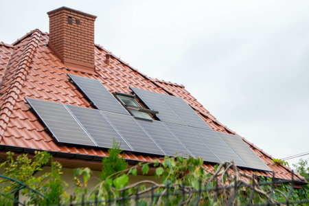 House roof with photovoltaic modules. Historic farm house with modern solar panels on roof and wall...
