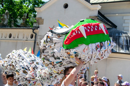 Cracow, Malopolska, Poland - 04.06.2023: The animated dragon marching during the Dragons Parade, the annual event in the center of Old Town. High quality photoのeditorial素材
