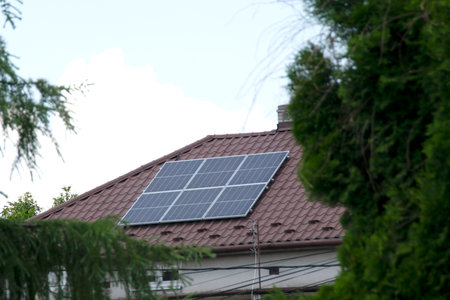 Installing a Solar Cell on a Roof. Solar panels on roof. Historic farm house with modern solar...