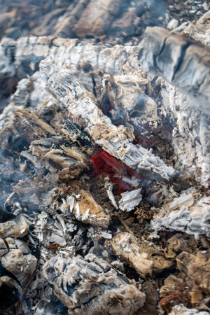 A piece of broken glass with smoke coming out of it. High quality photoの写真素材