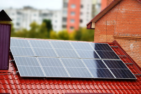 House roof with photovoltaic modules. Historic farm house with modern solar panels on roof and wall...