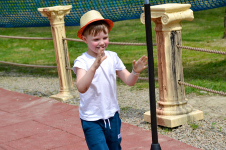 adventure climbing high wire park - people on course in mountain helmet and safety equipment. High quality photoの写真素材