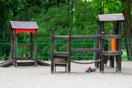 life of children in a modern city - little boy is having fun on the playground near the house. high quality photoの写真素材