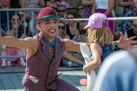 Cracow Malopolska, Poland - 09.06.2023: Street Theatre Festival. International annual event. Hugo Miro Hiszpania: HUGO Main Market Square from the side of the Church of St. Wojciech High quality photoのeditorial素材