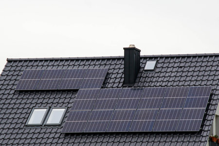 Historic farm house with modern solar panels on roof and wall Illustrationの写真素材