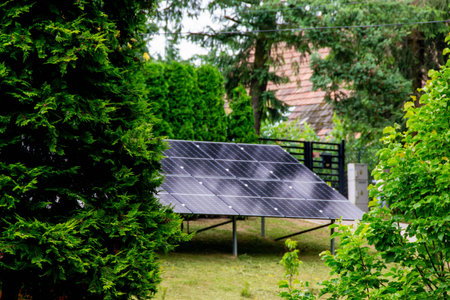 Historic farm house with modern solar panels on roof and wall Illustrationの写真素材