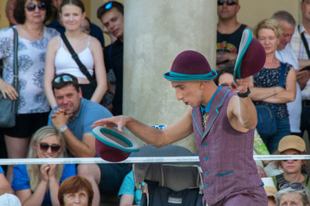 Cracow Malopolska, Poland - 09/06/2023: Street Theater Festival. International annual event. Hugo Miro Spain: HUGO Main Market Square from the side of the Church of St. Wojciech High quality photoのeditorial素材