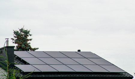 Historic farm house with modern solar panels on roof and wall Illustration