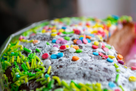 Traditional easter holiday table served with homemade easter cake . A cake with sprinkles on it is...